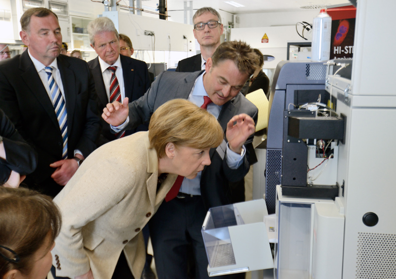 German Chancellor Angela Merkel visits the DKFZ and HI-STEM in 2014